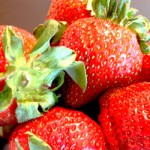 A close up photo of fresh strawberries.