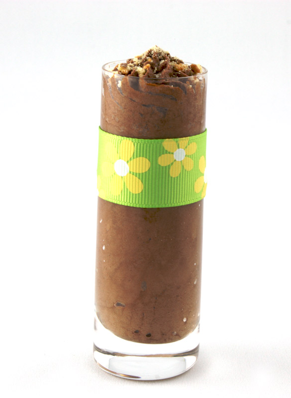 Gordon Ramsay Four-Minute Chocolate Mousse A photo of one chocolate mousse dessert in a shot glass with a green and yellow ribbon.