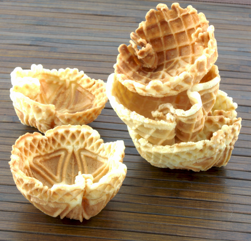 Waffle Bowls A photo of 5 waffle bowls on a wooden placemat.