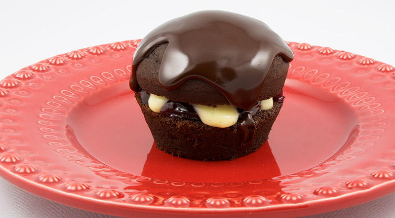 Martha Stewart's Black Forest Cupcakes A photo of a black forest cupcake on a red plate.