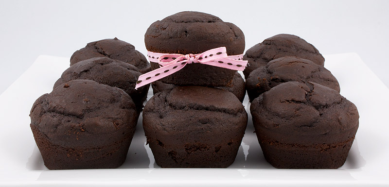 Martha Stewart's Black Forest Cupcakes A photo of black forest cupcakes on a white dish, one with a pink ribbon.