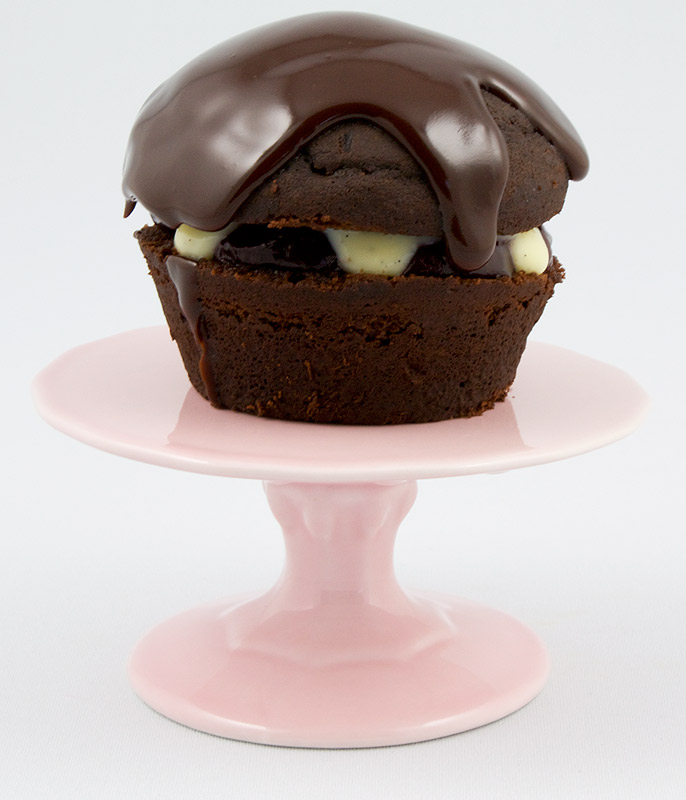 Martha Stewart's Black Forest Cupcakes A photo of a black forest cupcake on a pink mini cake stand.