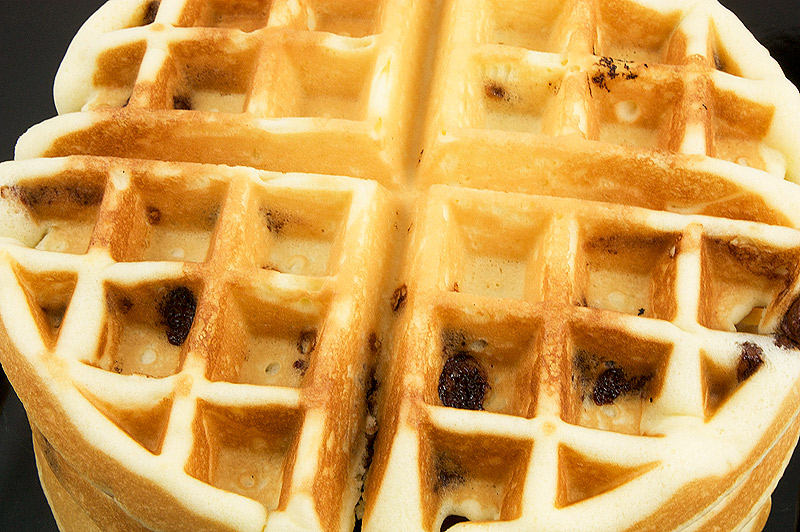 easy chocolate chips waffles recipe, simple chocolate chip belgian waffles recipe, easy Belgian Waffles recipe A close up photo of a stack of chocolate chip belgian waffles.