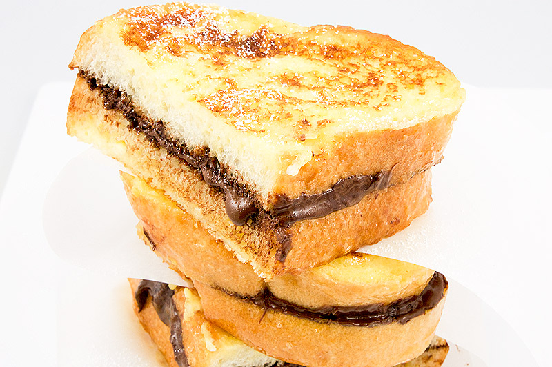 Donna Hay's breakfast recipes, Donna Hay's brunch recipes, Donna Hay's chocolate recipes A photo of a stack of chocolate french toast slices with parchment paper in between.