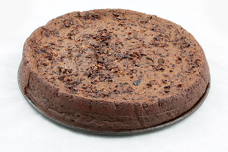 David Lebovitz desserts, french dessert recipes, flourless chocolate torte A photo taken looking down on David Lebovitz's Racines Cake dessert (flourless chocolate cake sprinkled with cocoa nibs).