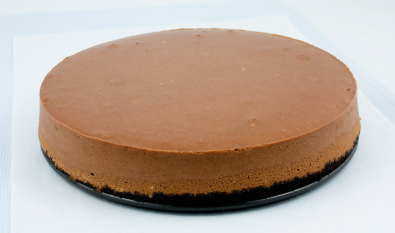chocolate dessert, dessert recipes with pictures, baked cheesecake recipe A photo of a plain chocolate cheesecake with an Oreo cookie crust.