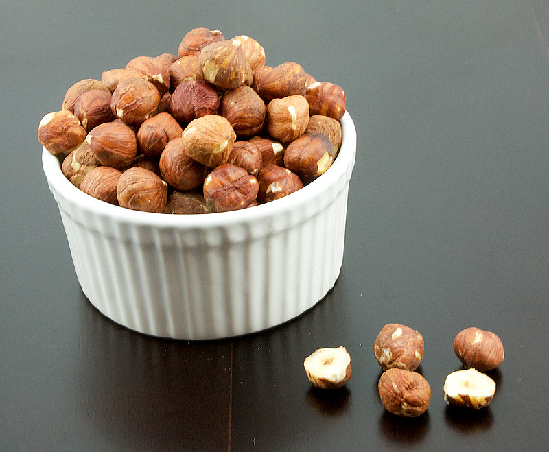 chocolate dessert, dessert recipes with pictures, baked cheesecake recipe A photo of a bowl of toasted hazelnuts.