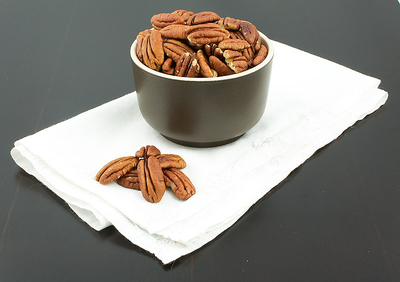 easy chocolate desserts, desserts with photos, quick and easy desserts A photo of a bowl of toasted pecans.