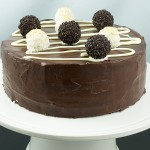 A photo taken looking down on a Ferrero Rocher White and Dark Chocolate Cake.