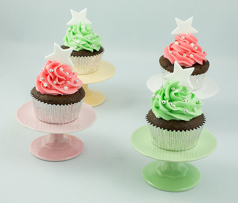 Christmas Cupcakes A photo of Dark Chocolate Cupcakes with Peppermint Marshmallow Cream Filling on individual cupcake stands.