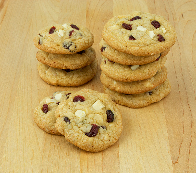 cranberry white chocolate cookies, white chocolate cookies recipe, easy cookies recipe, easy cookie recipes with few ingredients A photo of a couple of stacks of White Chocolate, Cranberry and Hazelnut Cookies.