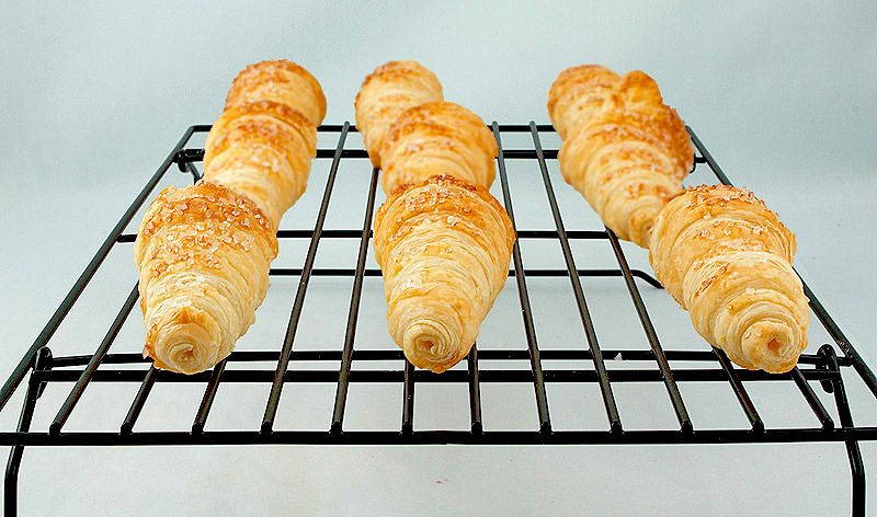 Pastry Horns A photo of pastry horns cooling on a wire rack.