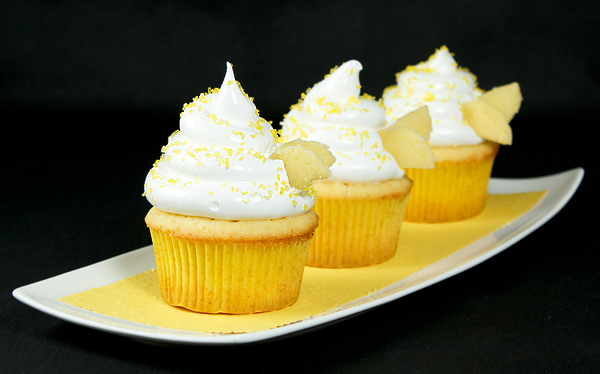 cute cupcakes, meringue icing, beehive cupcakes A photo of 3 Beehive Cupcakes placed in a row on a white, rectangular dish.