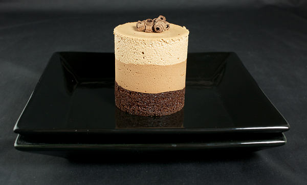 making chocolate mousse, recipes chocolate mousse cake, mousse recipe chocolate, gourmet cakes A photo of gourmet cake, Chocolate Mousse Cake with chocolate curls on a black dessert dish.
