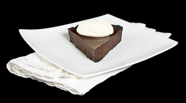 Oreo Chocolate Truffle Tart with Chocolate Glaze A photo of a slice of Oreo Chocolate Truffle Tart with Chocolate Glaze.