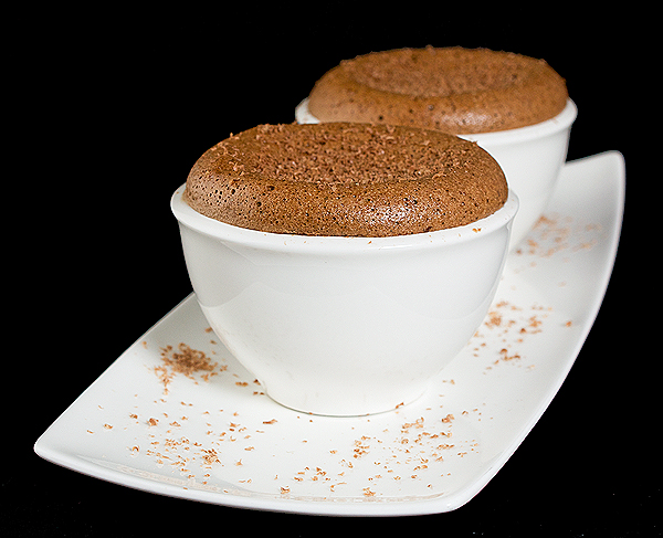 Chocolate Dessert - Chocolate Souffle A photo of two Chocolate Dessert, Chocolate Souffle served in white bowls and placed on a white rectangular dish.