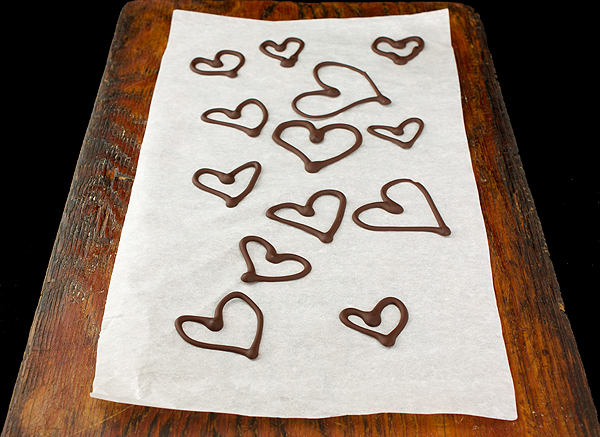 A photo of Chocolate Hearts used to garnish Mini Yogurt Mousse Cakes with Strawberries.