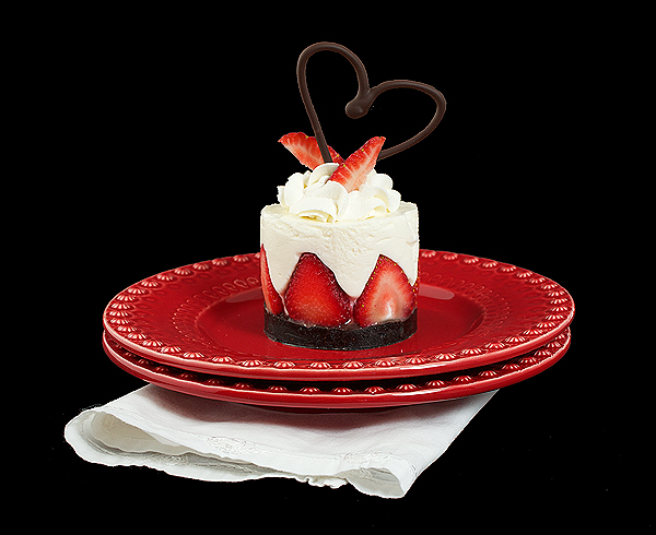 A photo of a Italian Dessert, dolce allo yogurt served on a red dessert dish.