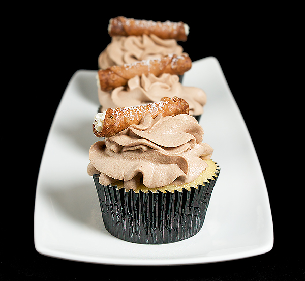 Vanilla Cupcakes A photo of 3 Vanilla Cupcakes.