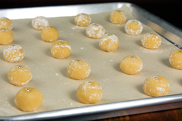 Almond Cookies A photo of Italian Almond Cookies on a baking sheet ready to be set in the oven for baking.
