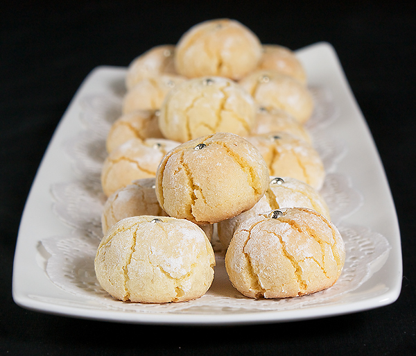 Amaretti A photo of Italian Amaretti Cookies displayed on a white rectangular dish.