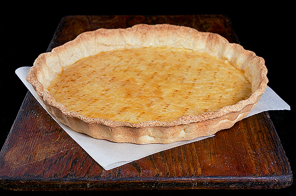 A photo of a Crostata pastry shell made using Pasta Frolla coated with Grand Marnier-Apricot Glaze.