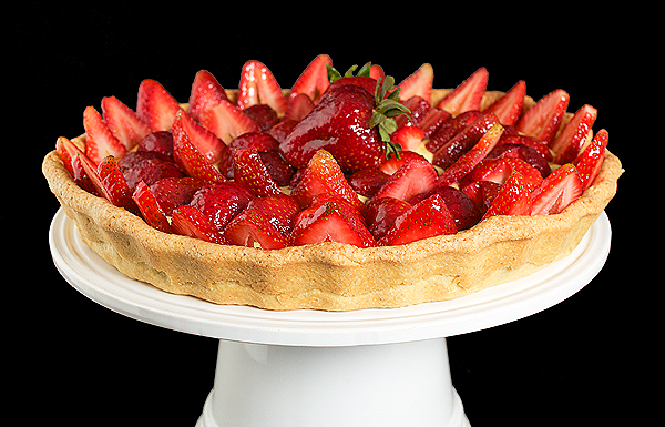 A photo of an Italian Dessert, Crostata di Fragole con Crema Pasticcera e Chantilly {Strawberry Tart} with a Grand Marnier-Apricot Glaze.