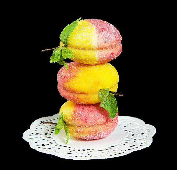 Pesche Dolci {Italian Peach Cookies A photo of 3 Pesche Dolci {Italian Peach Cookies} stacked one on top of the other.