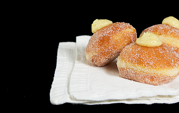 Crema Pasticcera A photo of a Crema Pasticcera filled Italian donut rolled in sugar.
