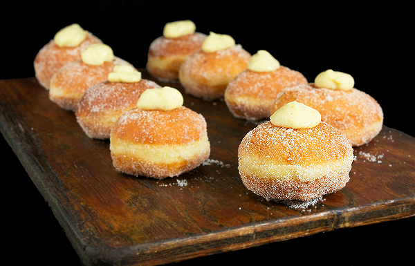 pastry cream, cream doughnuts, filled doughnuts, filled donuts A photo of Italian Filled Doughnuts rolled in sugar.
