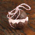 Triple Chocolate Fudge Cookies with Raspberry-White Chocolate Ganache Filling A photo of soft and chewy Triple Chocolate Fudge Cookies with Raspberry-White Chocolate Ganache Filling.