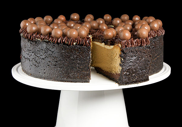 Grace's Sweet Life Baked Cheesecake A close up photo of a Baked Cheesecake on a cake stand.
