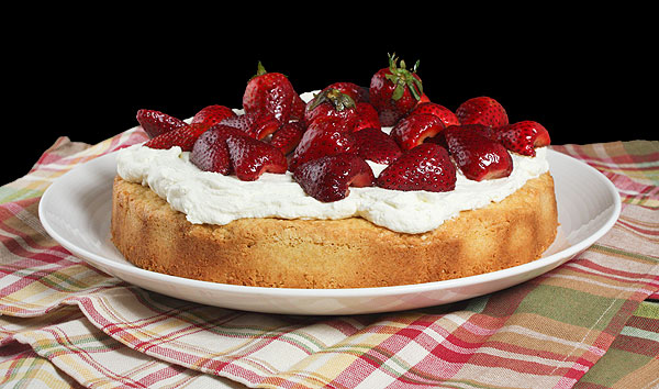 Grace's Sweet Life Cream Topping A photo of an Italian Polenta Cake topped with Mascarpone Cream.