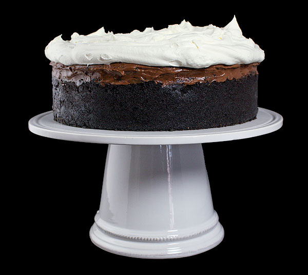 Mississippi Mud Pies A photo taken of a whole Mississippi Mud Pie on a white ceramic cake stand.