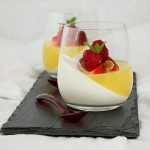 Grace's Sweet Life Layered Panna Cotta Dessert A photo of two Layered Panna Cotta Desserts with Fresh Berry Compote and Sliced Almonds.