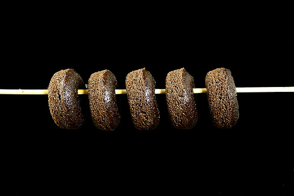 Mini Chocolate Cake Donuts A photo of Mini Chocolate Cake Donuts threaded on a skewer.