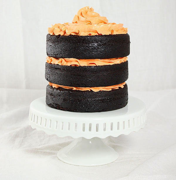Chocolate Pumpkin Cake from Grace's Sweet Life A photo of a three-layer Chocolate Pumpkin Cake decorated with orange-tinted Vanilla Bean-Swiss Meringue Buttercream.