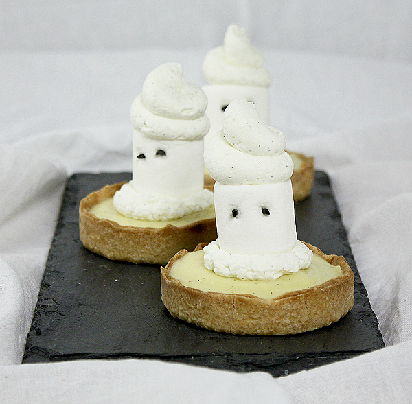 A photo of three Ghost Tarts on rectangular-shaped slate board.