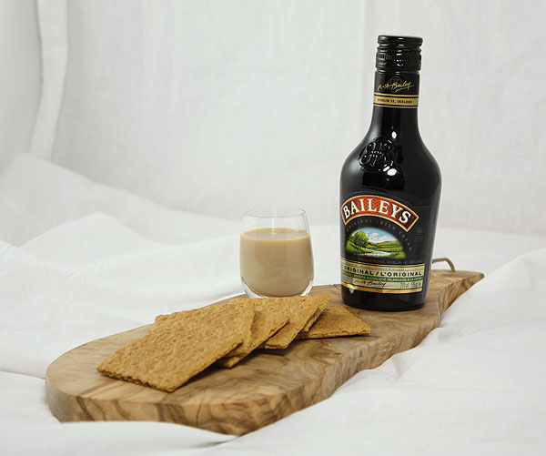 A photo of ingredients, Baileys and graham crackers, used in Spike Smores Recipe.