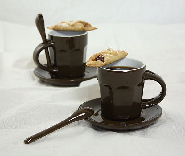 Photo of two cups of espresso with Nutella cookies.